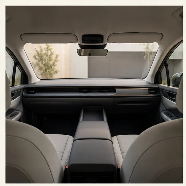 A clean, unbranded vehicle cabin viewed from the rear seats